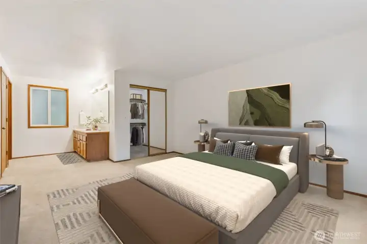 Spacious primary suite featuring a large bedroom layout, attached vanity area, and generous walk-in closet—creating a true all-in-one retreat.