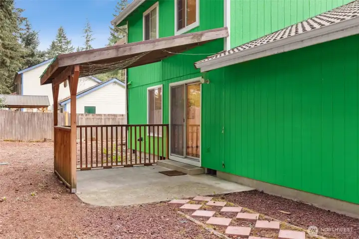 Step right outside to a covered patio—perfect for outdoor dining, grilling, or simply unwinding in the fresh air. The space offers a smooth transition from indoor living to the backyard, with room to personalize and make your own outdoor oasis.
