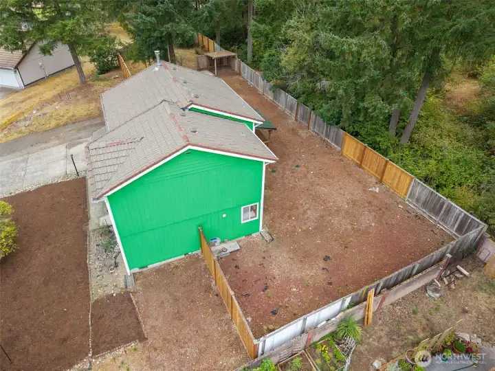 Enjoy a spacious, fully fenced yard surrounded by mature evergreens—offering privacy, shade, and endless potential. Whether you envision a garden, play space, or outdoor entertaining area, this generous lot provides the perfect blank slate to make it your own.