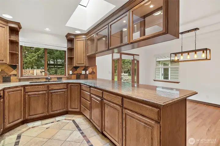 Tiled kitchen, ample counter & storage space.
