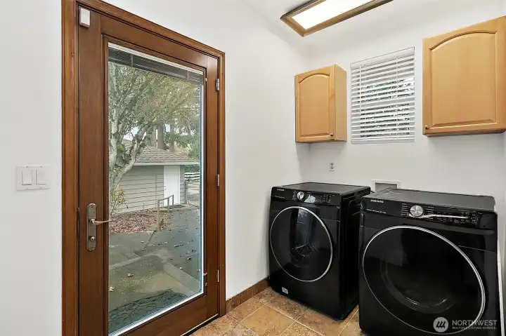 Utility area with Washer/Dryer that stays with home.