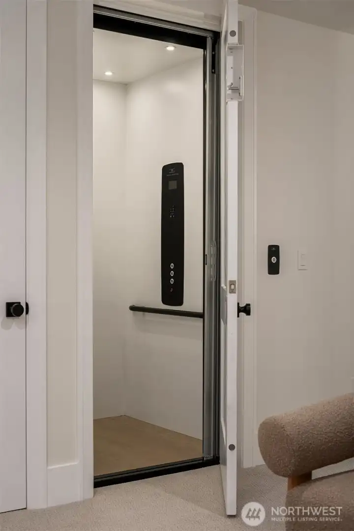 Private in-home elevator connecting all three levels for effortless movement throughout the home.