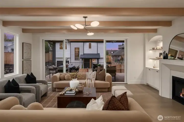 Great room flows directly to the outdoor patio through large sliding doors, ideal for indoor–outdoor entertaining. Sonos speakers connecting the kitchen, great room, and patio keep you dancing throughout the entertaining spaces.