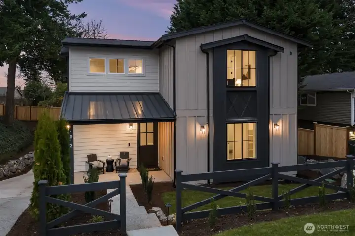 Refined modern farmhouse design featuring clean lines and a welcoming covered entry.