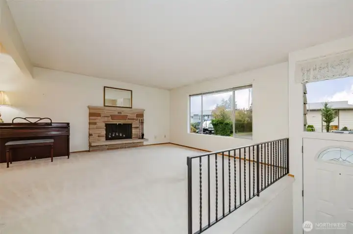 Entrance leads to a large living room and fireplace