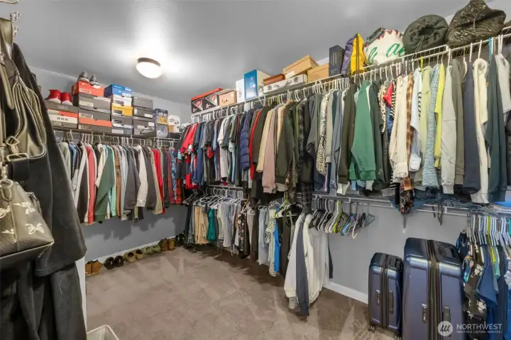 Primary bathroom with huge walk in closet.