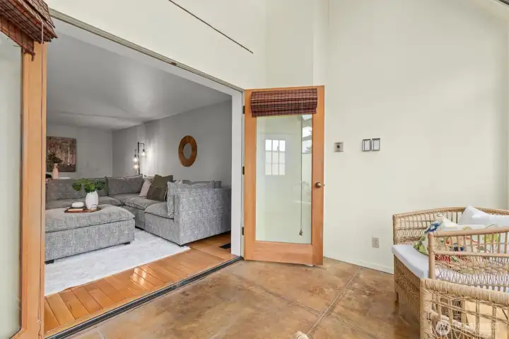 French doors lead to the solarium, or sun room. A cozy haven for extended entertaining, or your favorite plants.