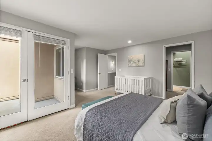 A view towards the balcony and also looking towards the walk-in closet.