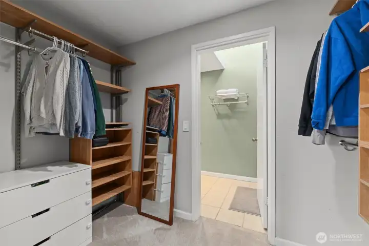 The primary's walk-in closet looking towards the bathroom.