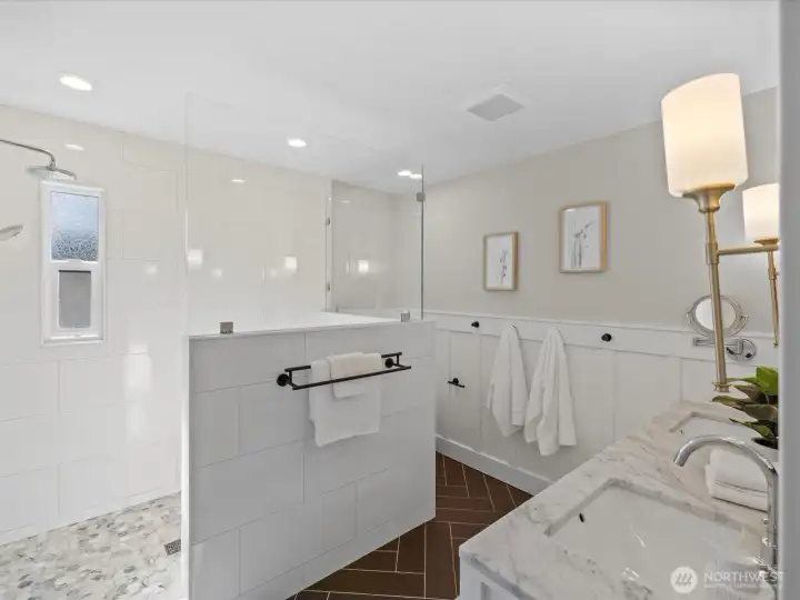 Bathroom with walk-in shower, tile surround, and glass enclosure