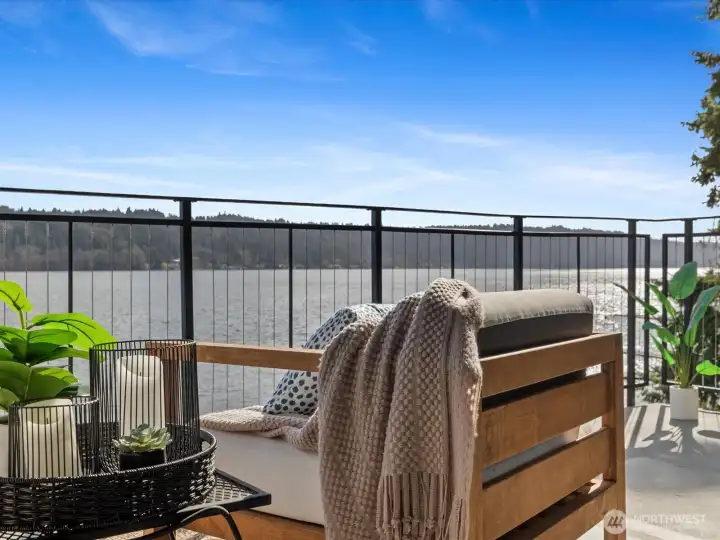 Private deck seating area with direct Lake Sammamish waterfront views and railing