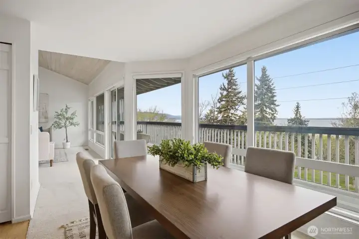 Windows extend to dining room too.