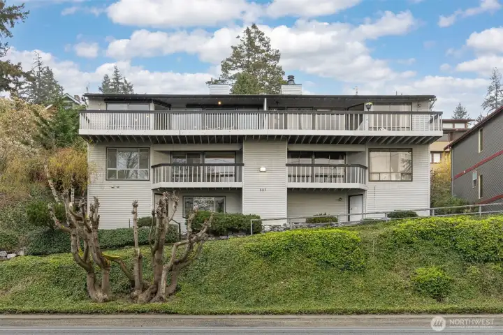Northwest facing front of building of two units.