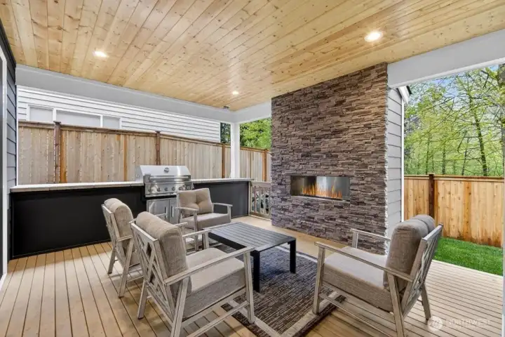 Incredible covered deck with built-in BBQ and outdoor fireplace