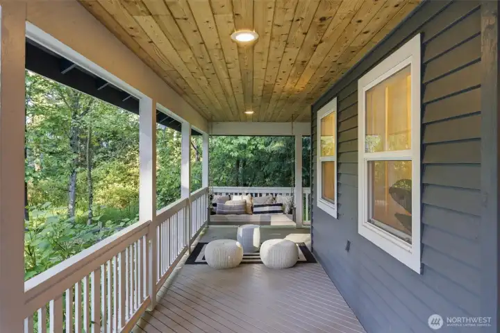 Wraparound porch designed to take in tranquil nature views year-round