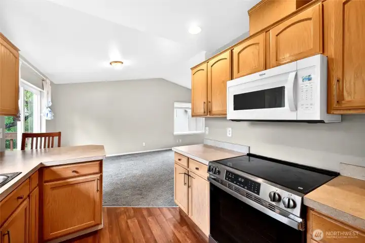Kitchen view withh newer appliances and lvp flooring