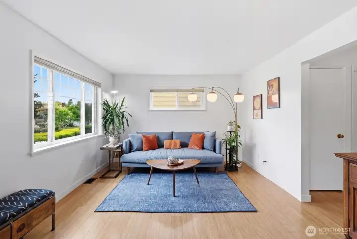 Welcoming sitting room full of natural light.
