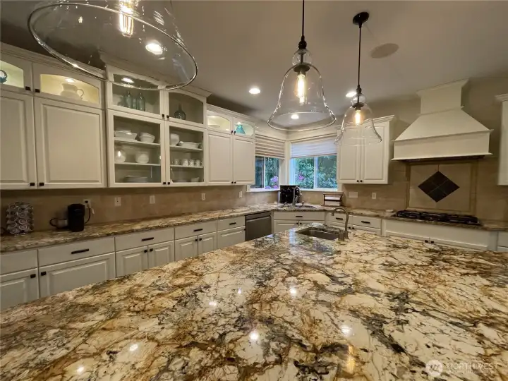 KITCHEN w/CORNER SINK & DBLE WINDOWS, CUSTOM CABINETS, GRANITE COUNTERS & HUGE ISLAND