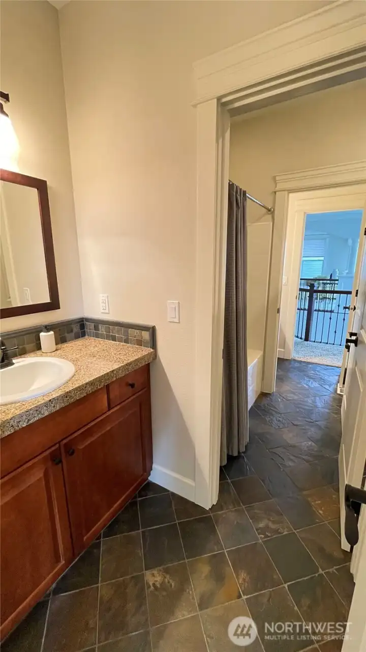 THE MAIN BATH STRETCHES FROM THE HALLWAY TO HALLWAY MAKING IT A UNIQUE WALK-THRU FROM ONE END TO THE OTHER. SECOND SINK ON THE OTHER SIDE OF THE TUB/SHOWER.