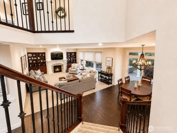 LOOKING DOWN 2ND STAIRCASE to EATING NOOK, GREAT ROOM and a PEAK at the COVERED REAT PATIO