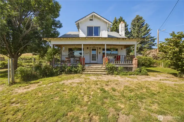 Charming Craftsman on 10+ acres with multiple outbuildings and another home.