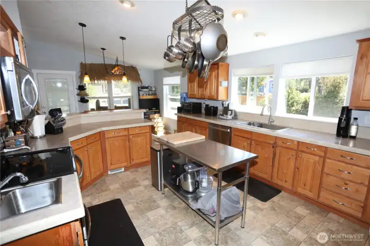 Stainless steal island stays with home. Handy second sink by the stove.