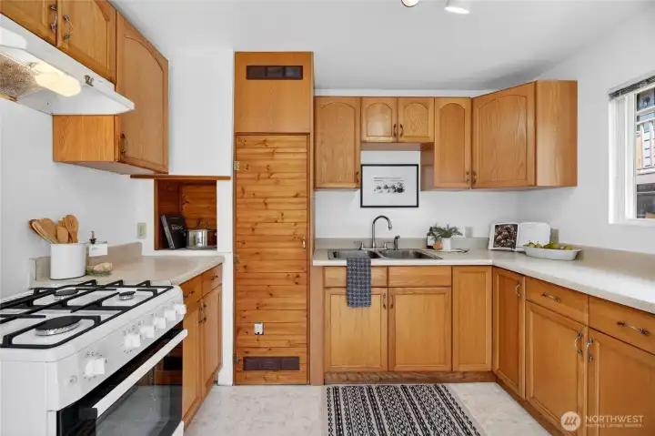 Cozy kitchen with ample counter space and storage. Cozy kitchen with ample counter space and storage.