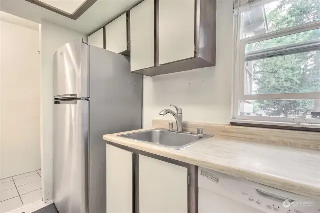 Stainless appliances complement this kitchen.