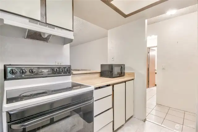 The kitchen has ample cabinets and counter space.