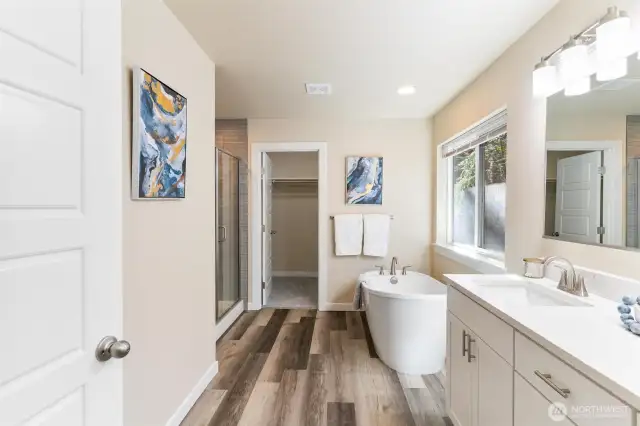 Relax in the spa-like 5-piece ensuite bath, complete with a soaking tub, walk-in shower, and dual vanities.