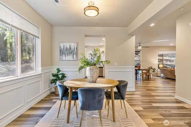 Nestled between the living room and kitchen, this open-concept dining area offers a welcoming atmosphere for family and friends.