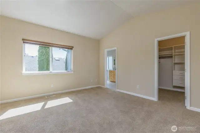 Primary bedroom with walk-in closet and private bath