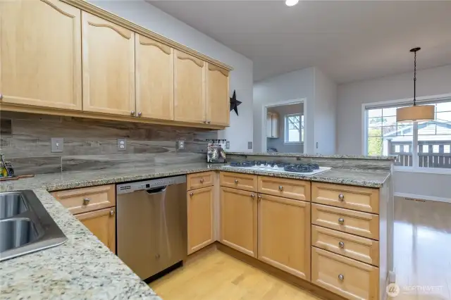 Kitchen is central with dining room on one side and family room on the other