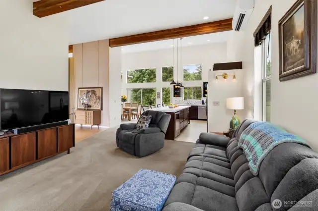 Open concept transition from the living room to the kitchen and dining area- perfect for entertaining.