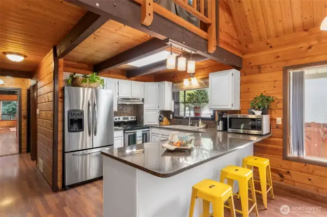 The kitchen features granite countertops, stainless steal appliances and a greenhouse window.