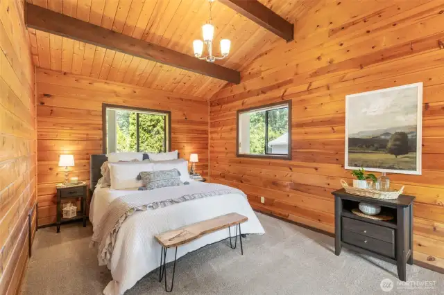 The upstairs, private, primary suite is a generous size and has ample room for a king size bed and a sitting area. The suite includes a walk-in closet and private bath.