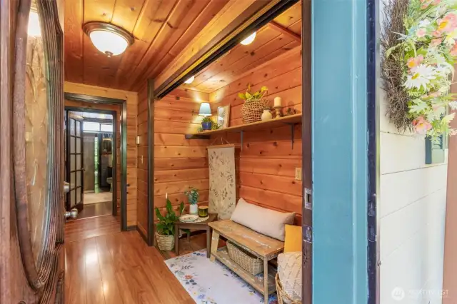 The foyer has many options. Keep the current open concept, or add back the doors for added storage or laundry.