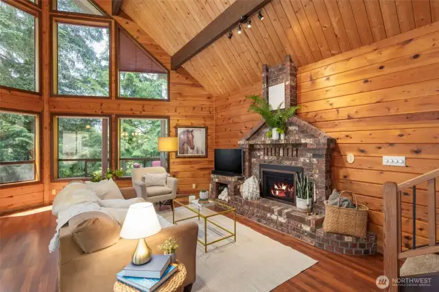 The cozy fireplace with propane insert creates a gathering place to relax.