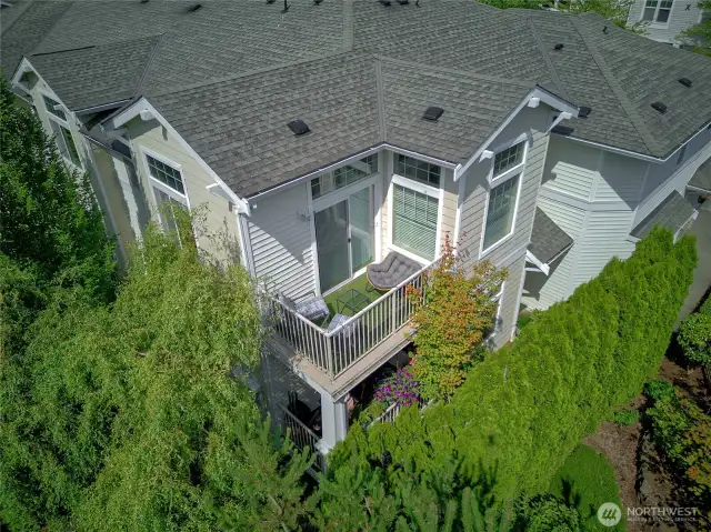 Lush foliage surround the condo's private balcony