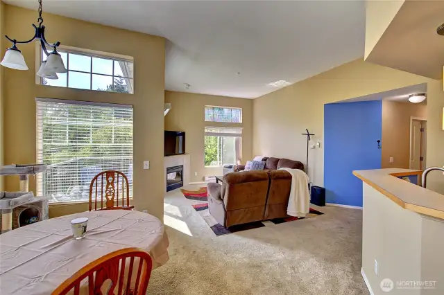 Open living concept with tall ceilings and windows