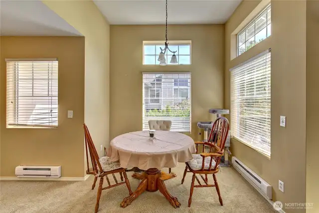 Dining area surrounded by more windows