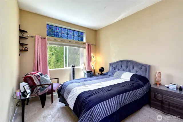 Primary bedroom with tall ceilings