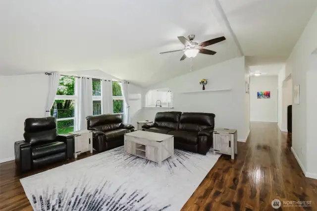 Love the vaulted ceiling and floor to ceiling windows! Tons of light! Engineered hardwood is gorgeous!