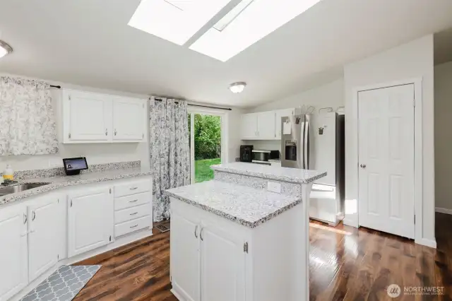 All the cabinet space AND a pantry? Yep! Backyard BBQ anyone? It's right out that door!