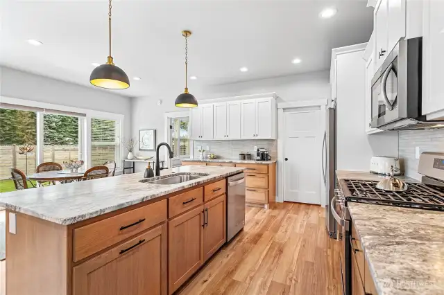 Plenty of storage with tons of cabinets. Gas stove & large sink