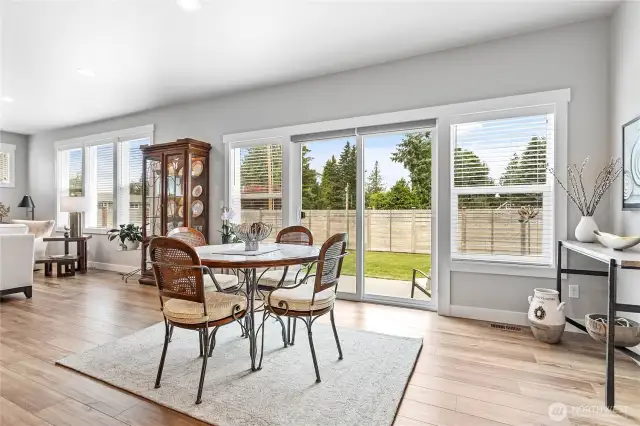 Sliding door w/extra windows leading to large patio