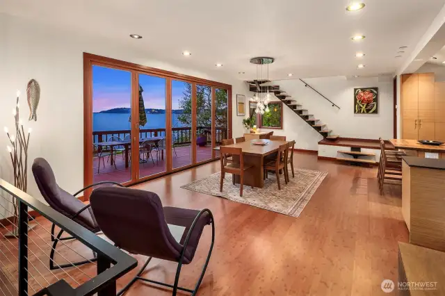 Entering your main floor everything is clean lines and eco-friendly materials. The flow of this home welcome friends with open arms and stellar views. Just beyond the kitchen sits a beautiful half bath.
