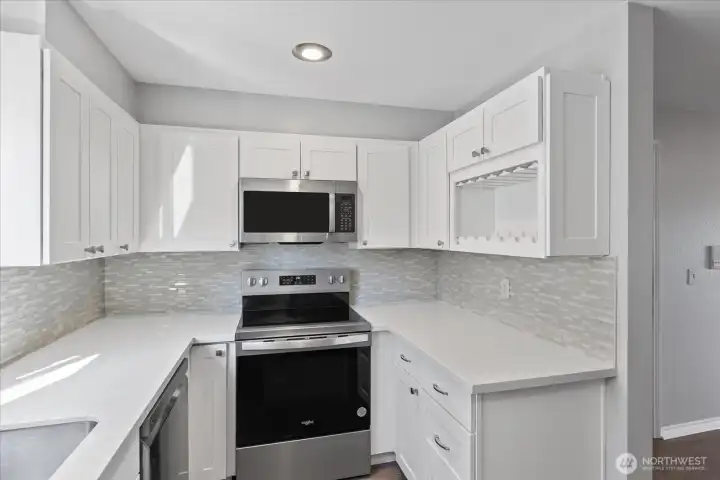 Modern kitchen with built-in wine rack and lots of storage.