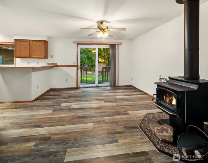 Wood Fireplace next to with view of slider to back yard