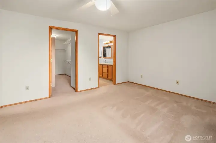 primary bedroom looking at walk in closet and bathroom
